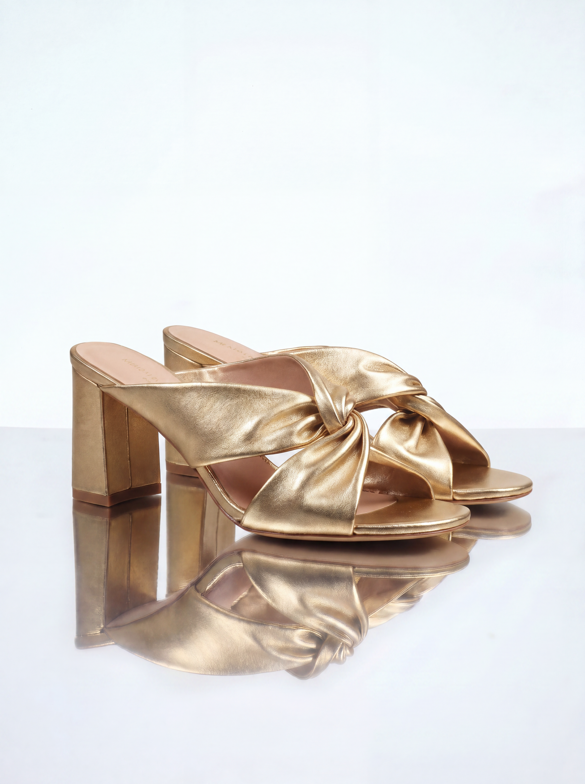 Tamarama White heeled mules by Diane Perreau