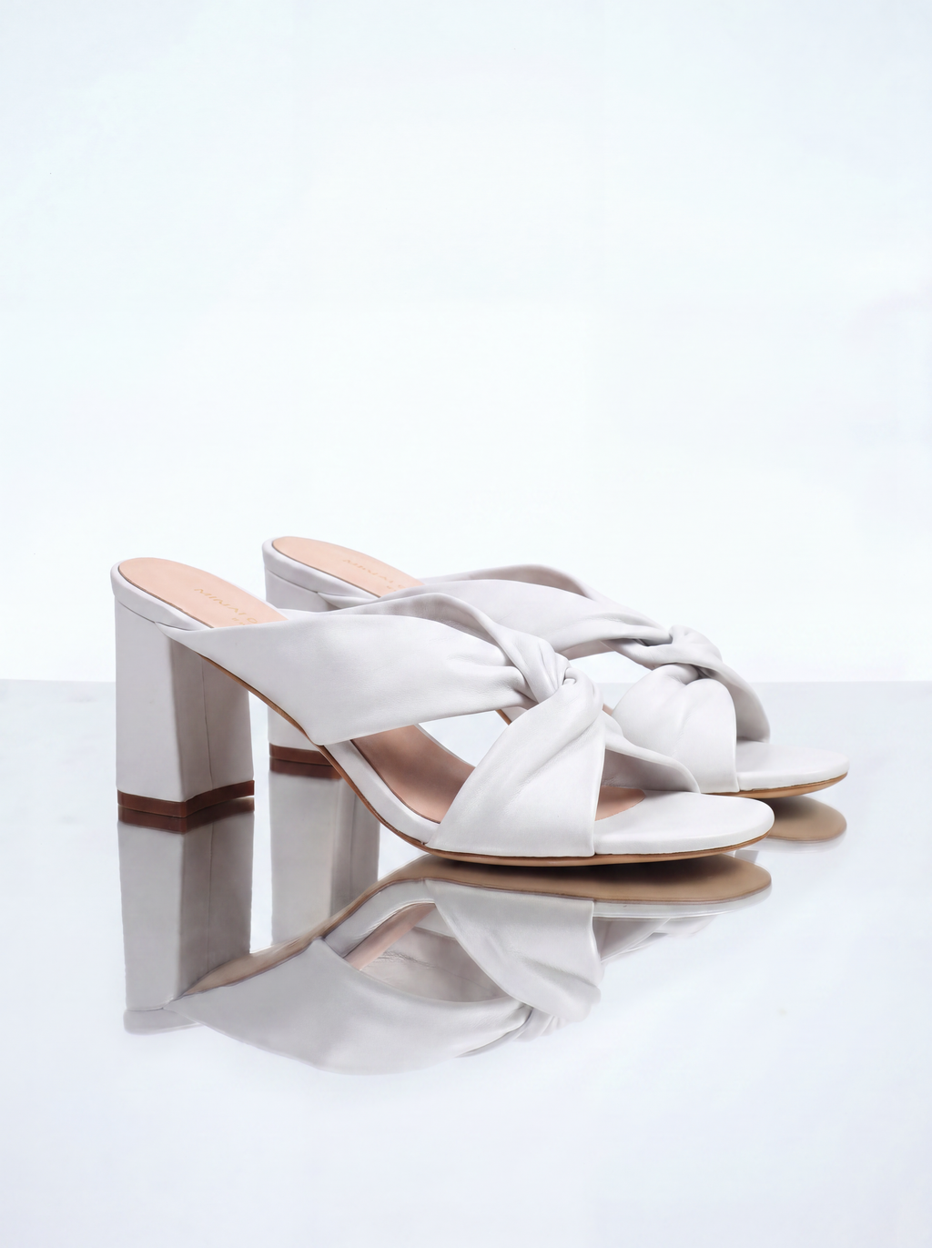 Tamarama White heeled mules by Diane Perreau