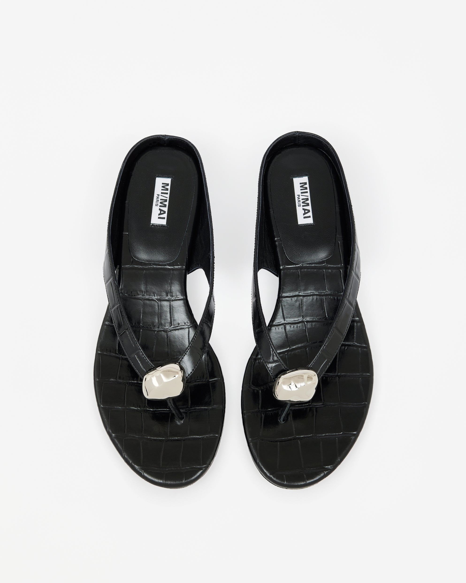 Eero Black flat mule with wide black leather strap