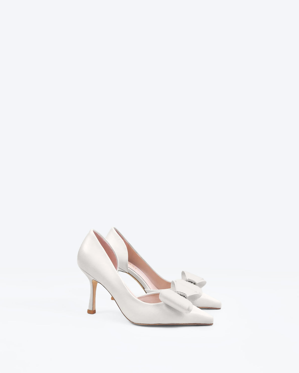 Iris White Leather pointed-toe pumps with bow and rhinestone embellishment