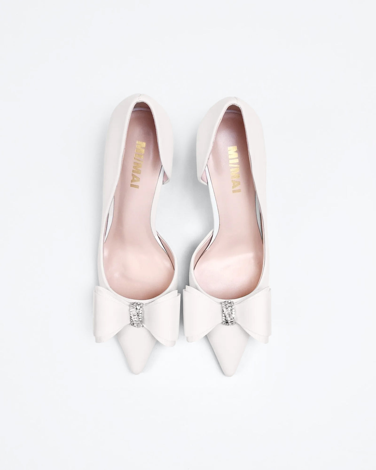 Iris White Leather pointed-toe pumps with bow and rhinestone embellishment