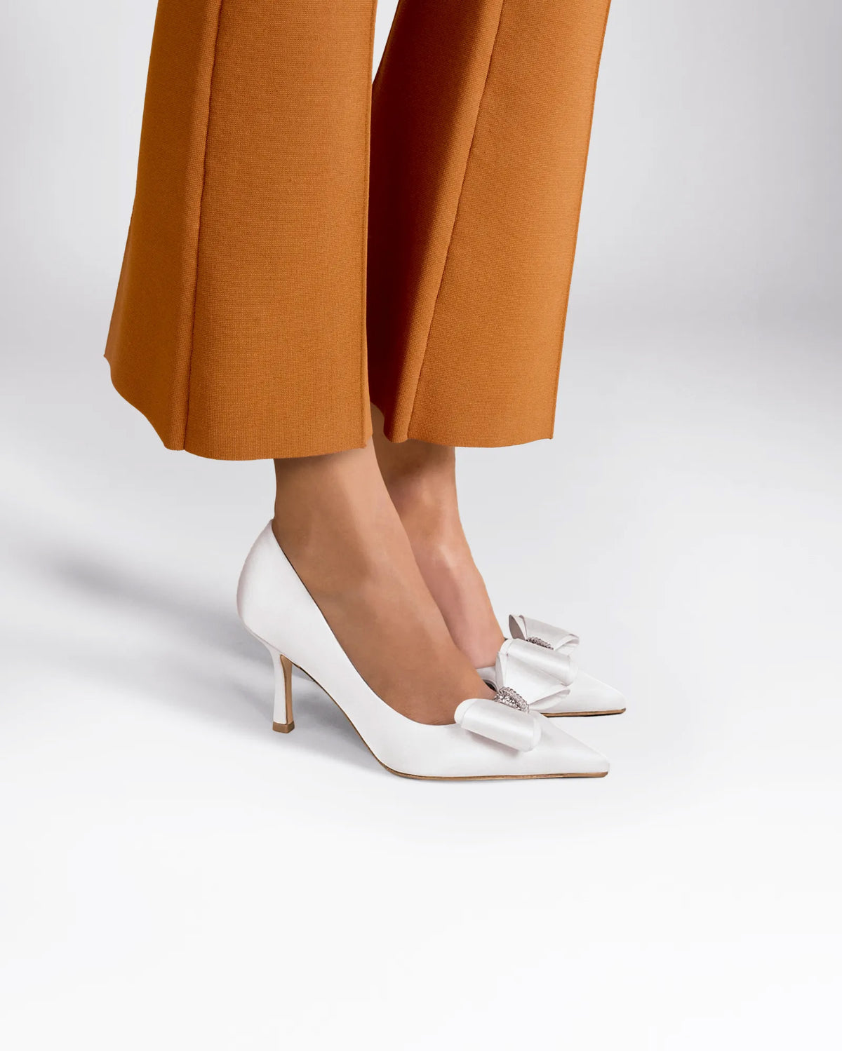 Iris White Satin white satin pumps with bow and rhinestone embellishment