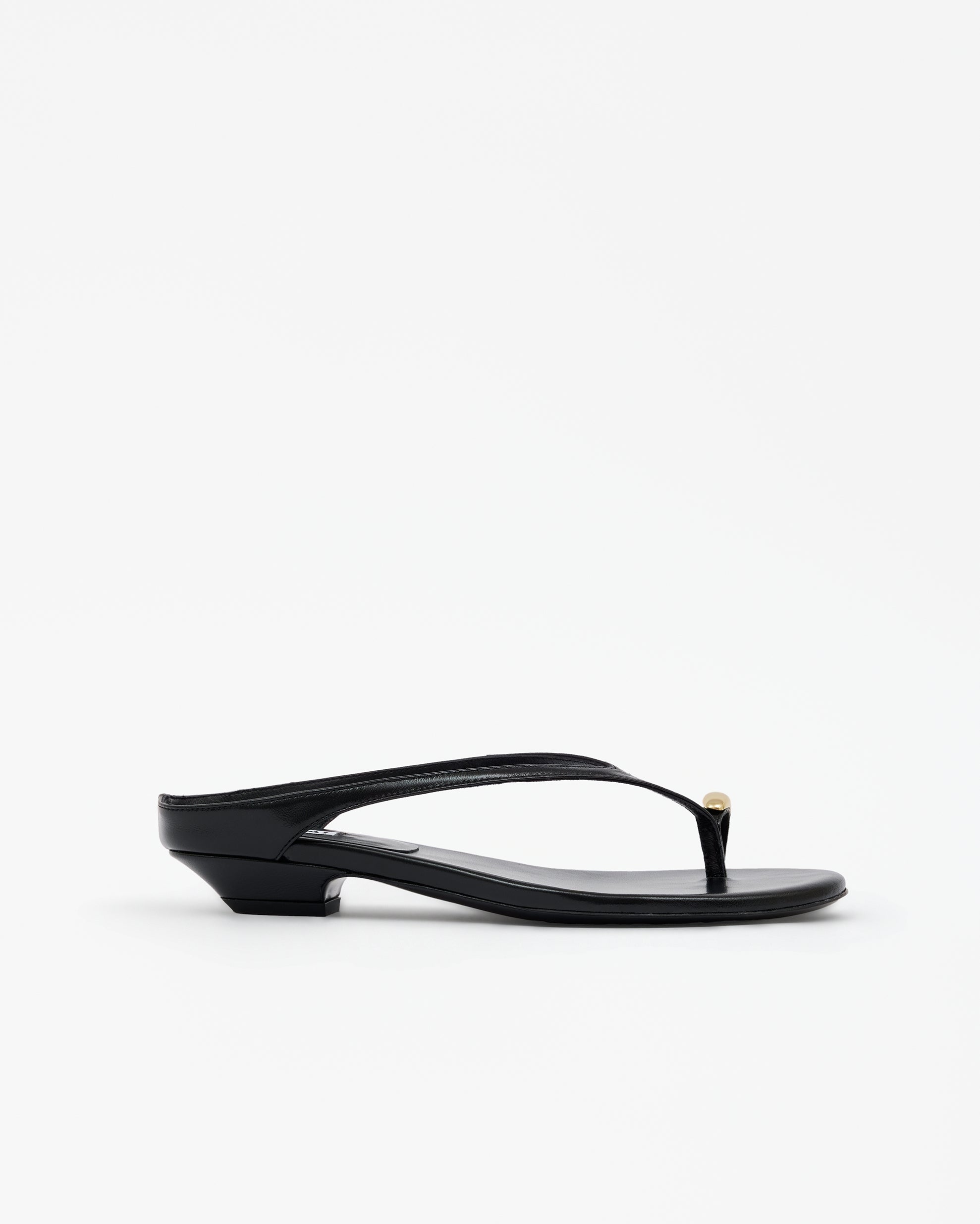 Eero Black flat mule with wide black leather strap