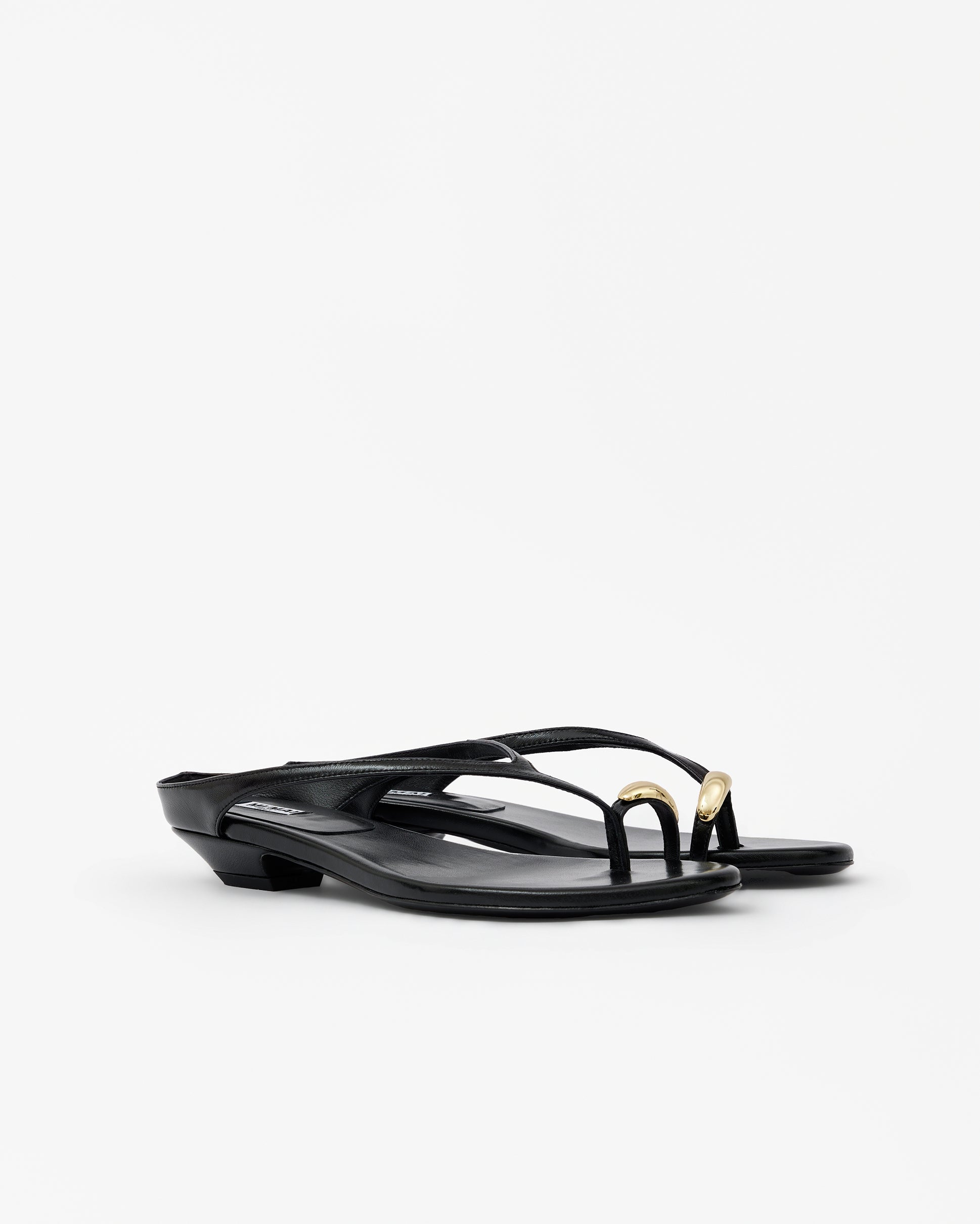 Eero Black flat mule with wide black leather strap