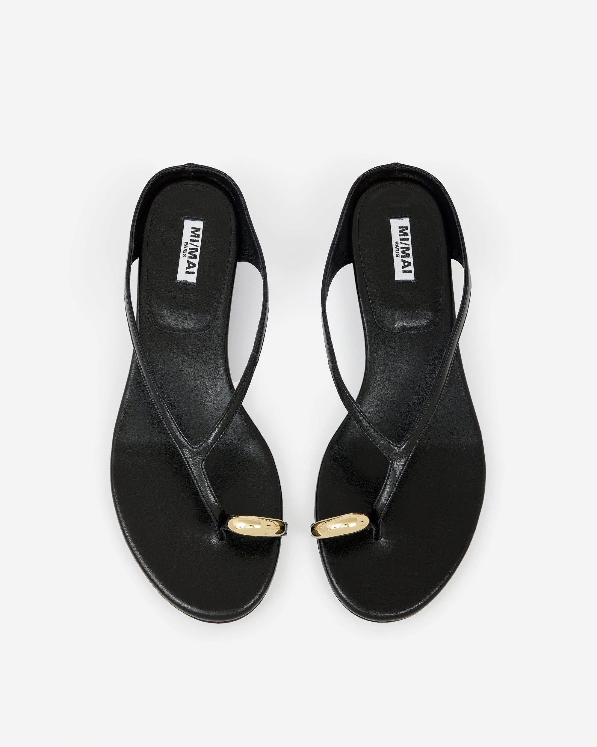 Eero Black flat mule with wide black leather strap