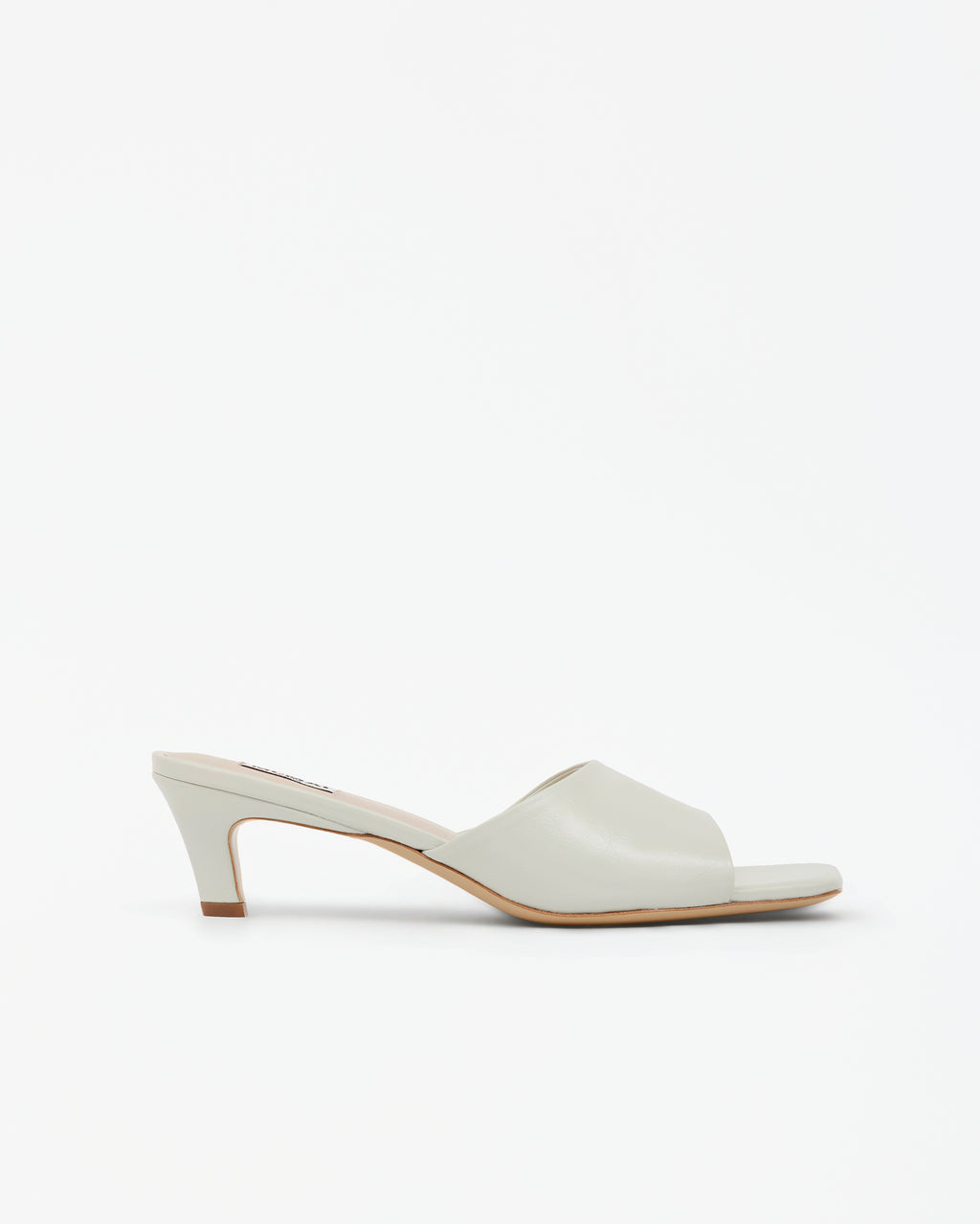 Mule en cuir glossy blanc à talon bas Liz White
