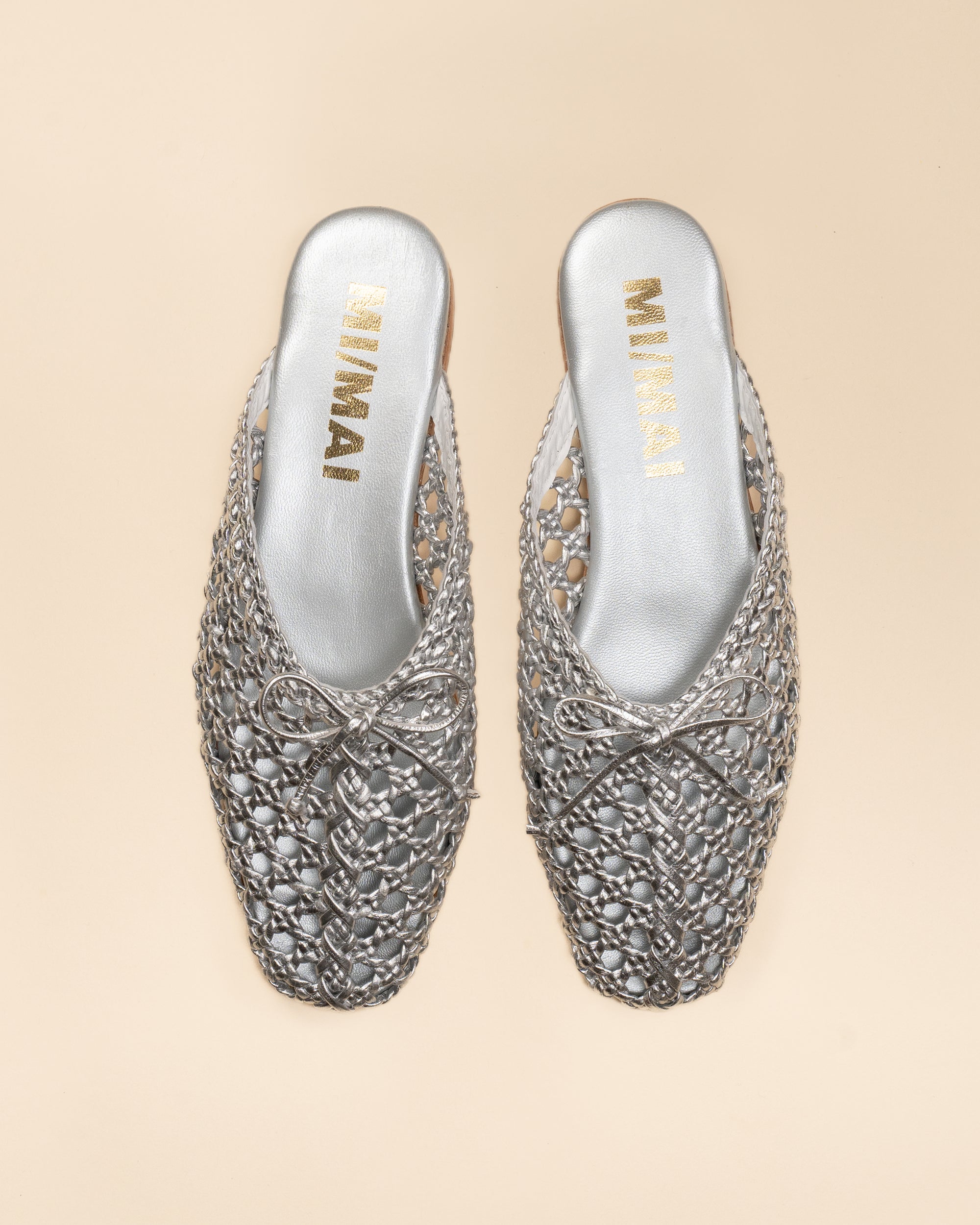 Mules plates en cuir tressé doré Lucian Silver
