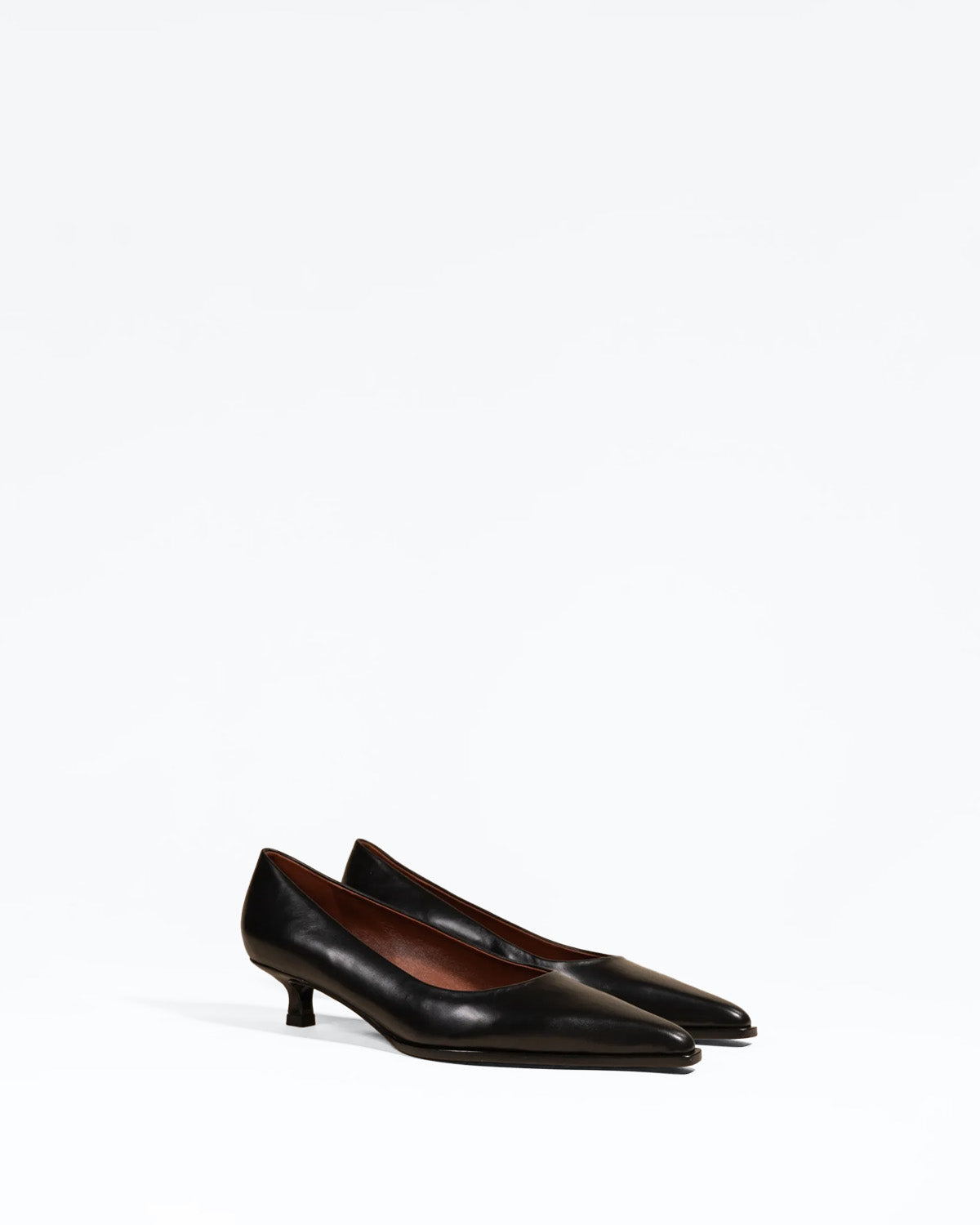 Ray Black pointed-toe pump with a small spool heel in black leather