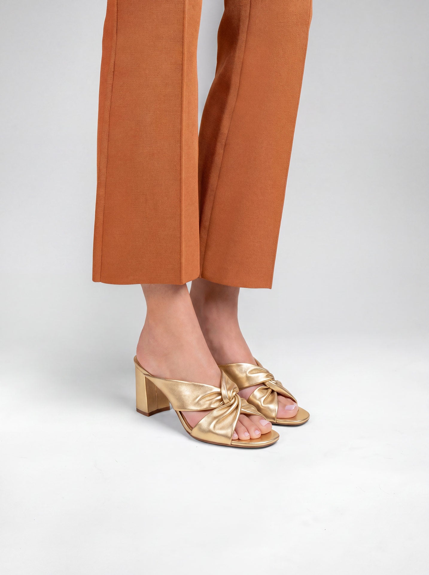Tamarama White heeled mules by Diane Perreau