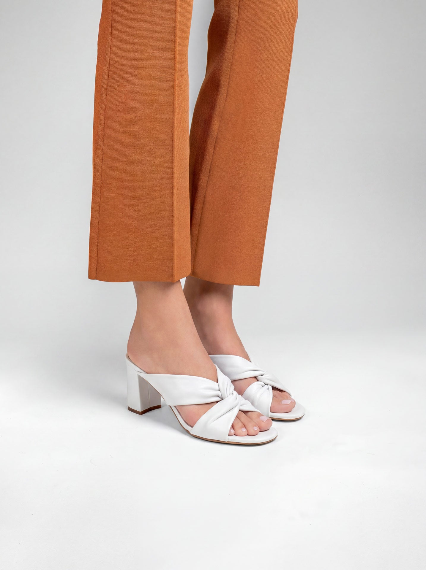 Tamarama White heeled mules by Diane Perreau