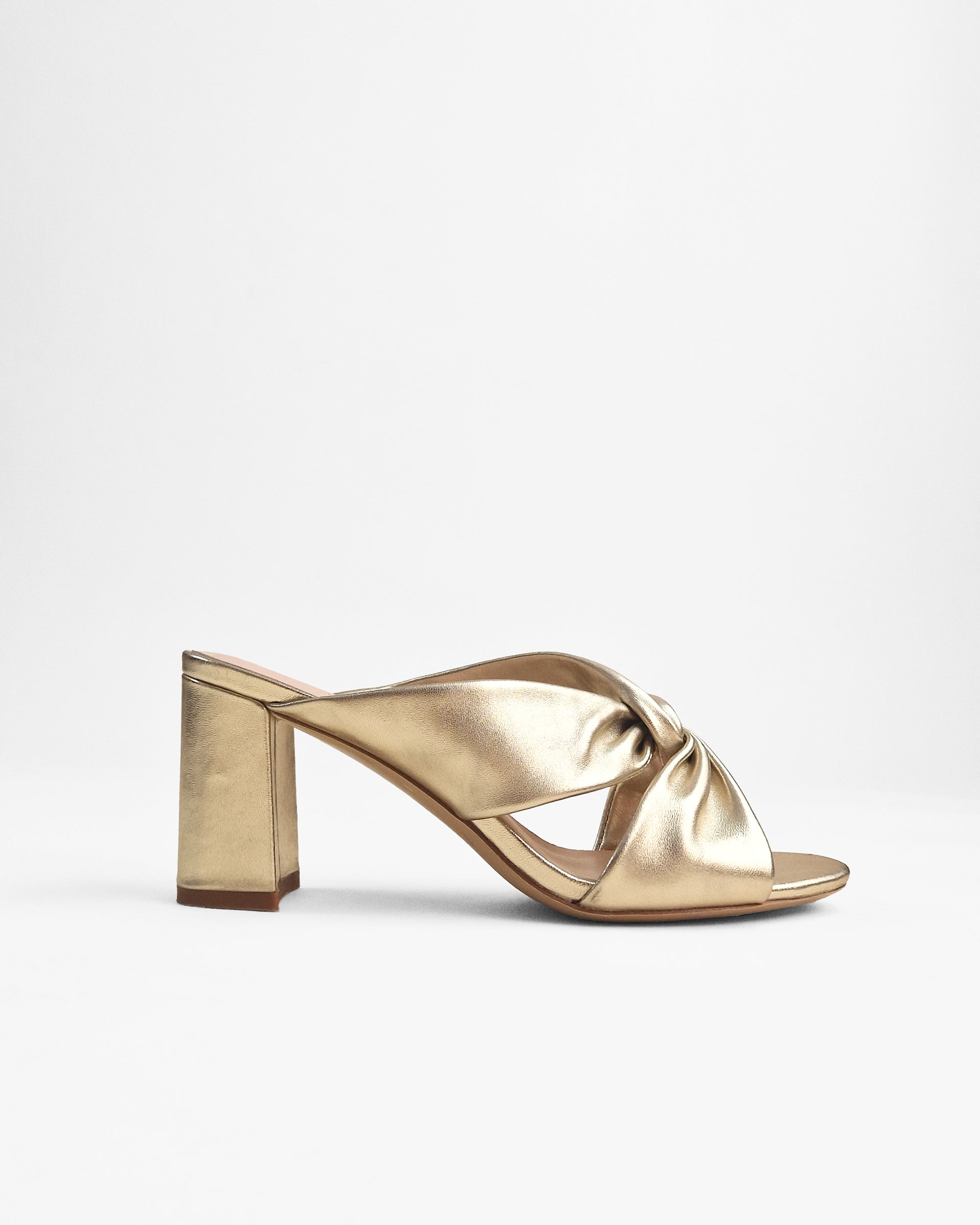Tamarama White heeled mules by Diane Perreau