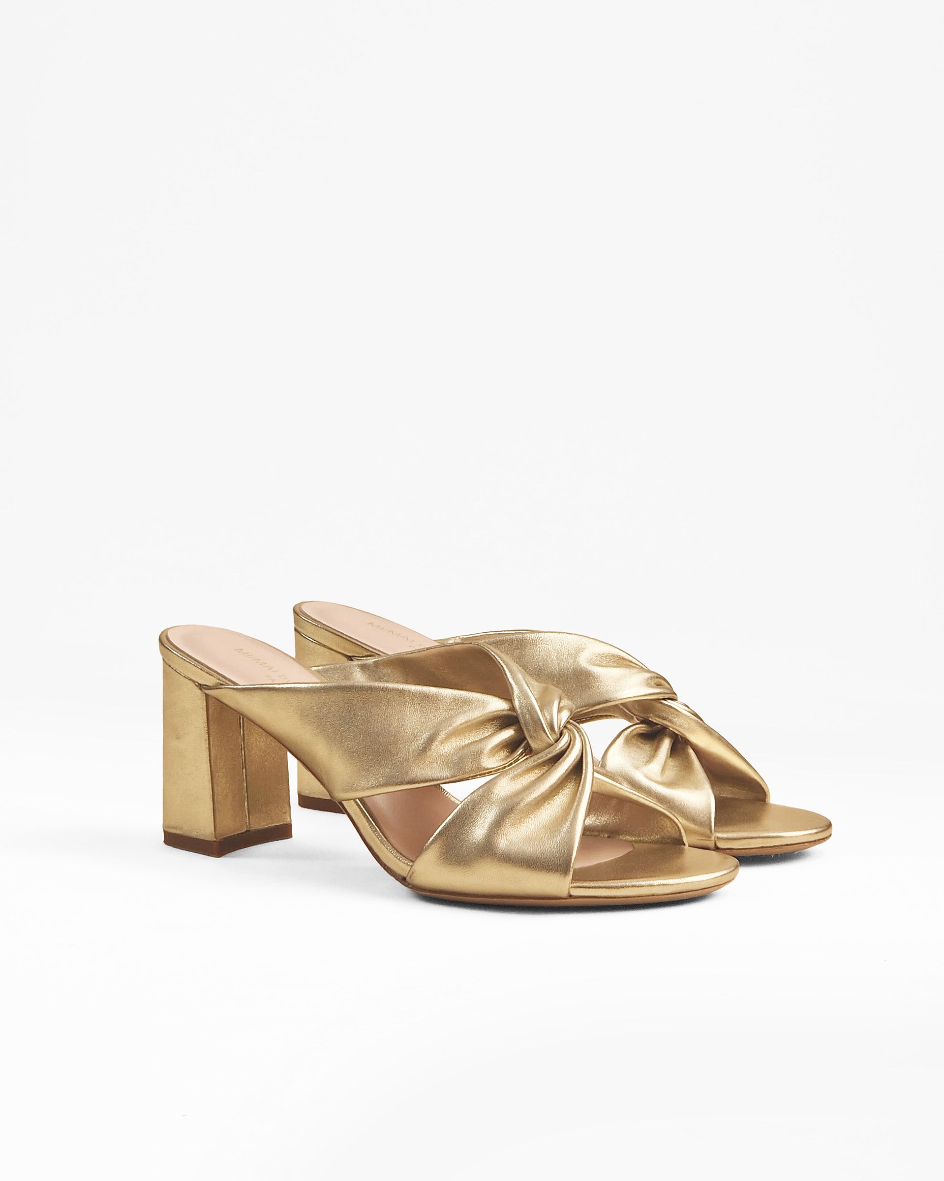 Tamarama White heeled mules by Diane Perreau