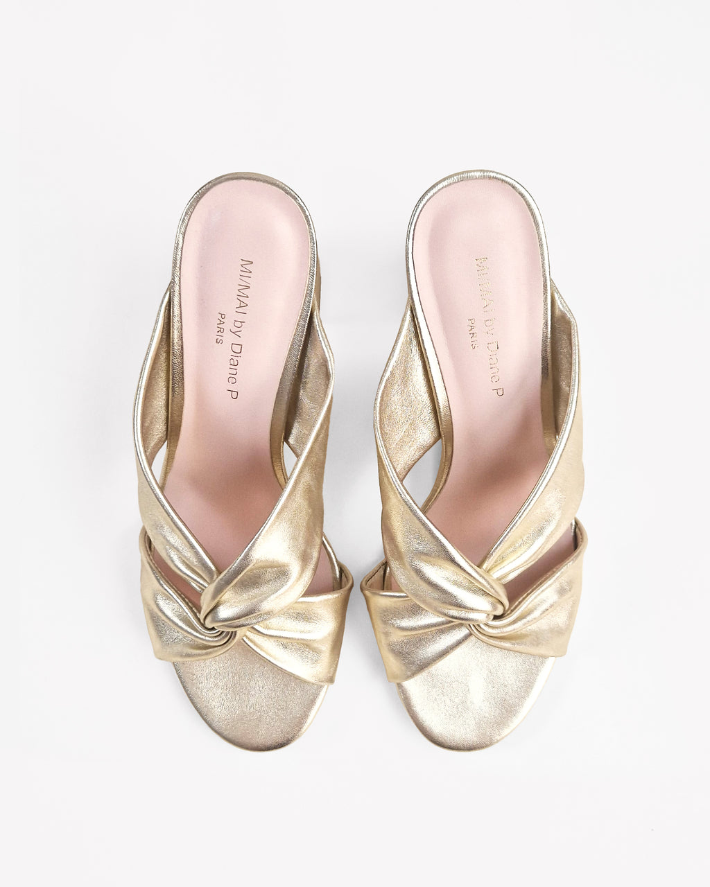Tamarama White heeled mules by Diane Perreau
