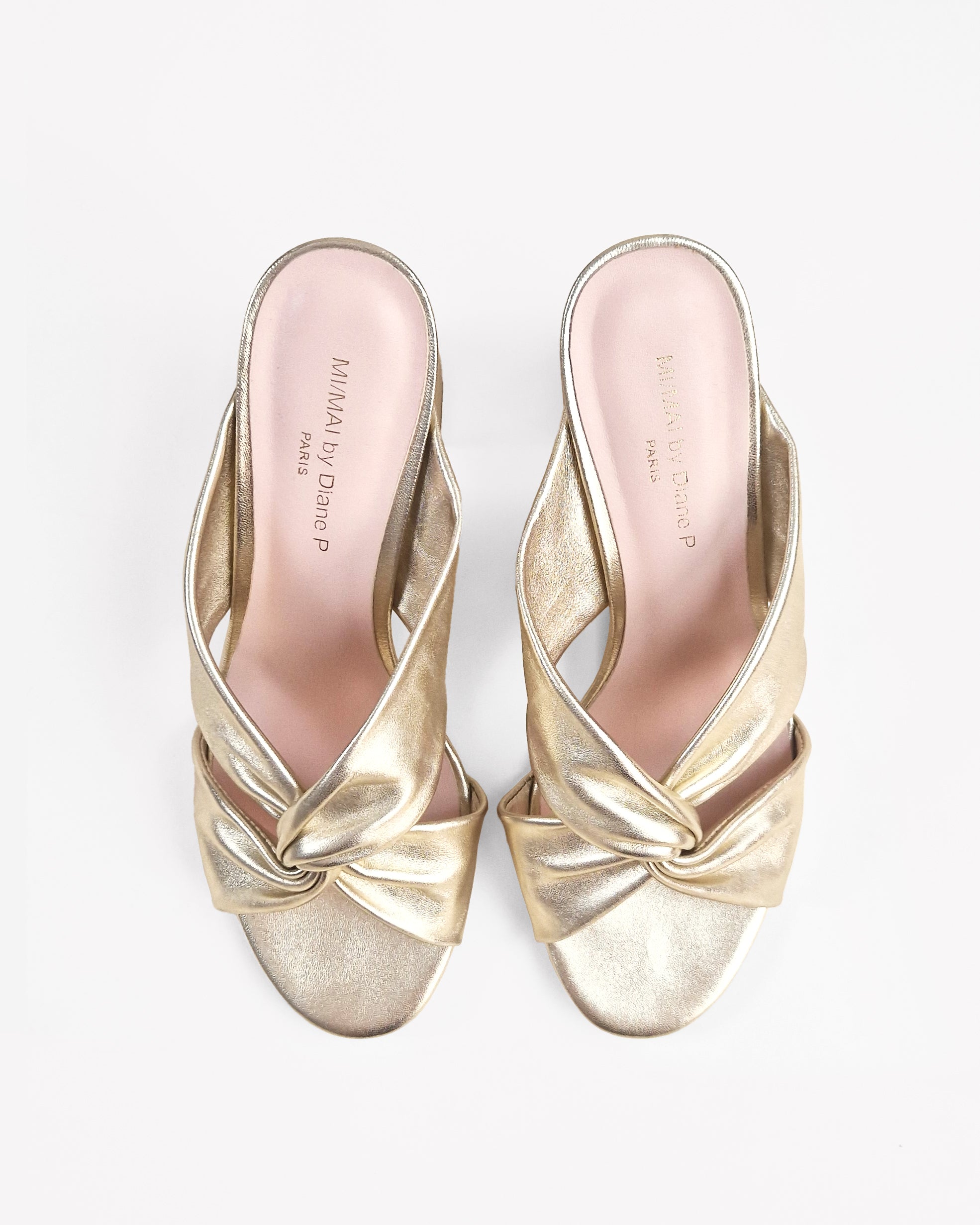 Tamarama White heeled mules by Diane Perreau