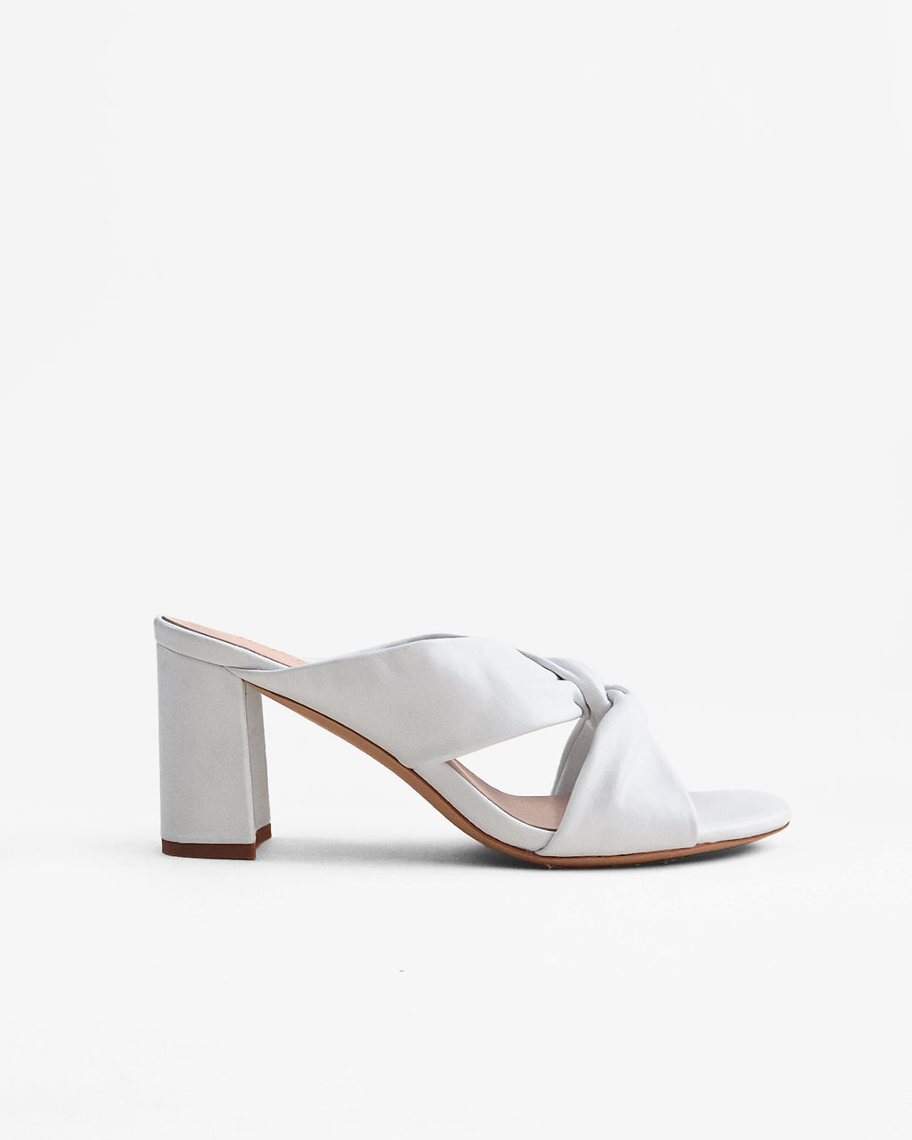 Tamarama White heeled mules by Diane Perreau