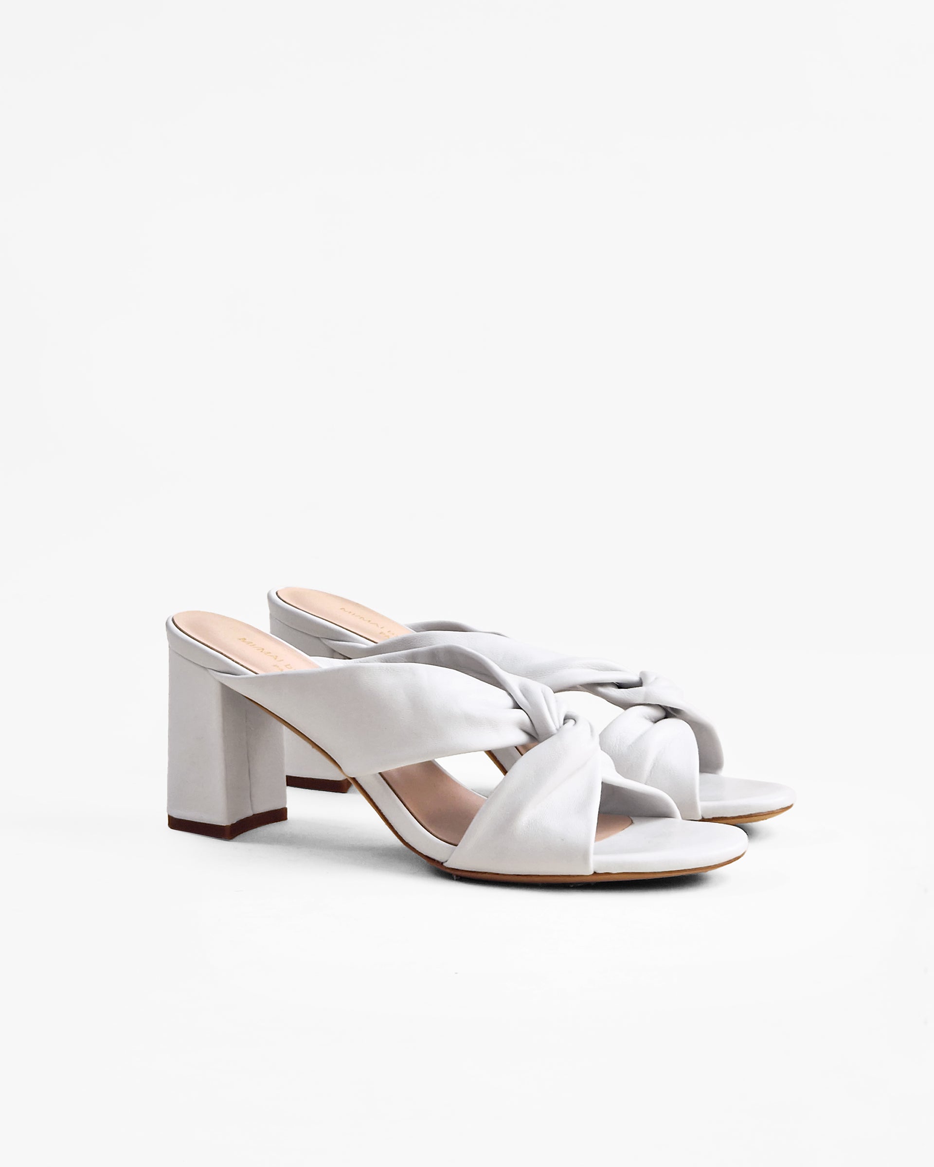 Tamarama White heeled mules by Diane Perreau