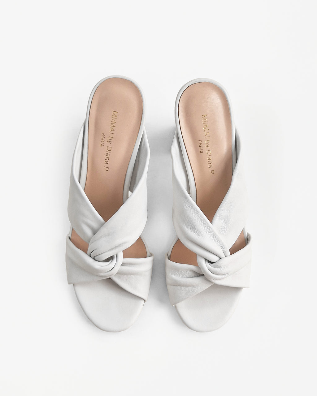 Tamarama White heeled mules by Diane Perreau