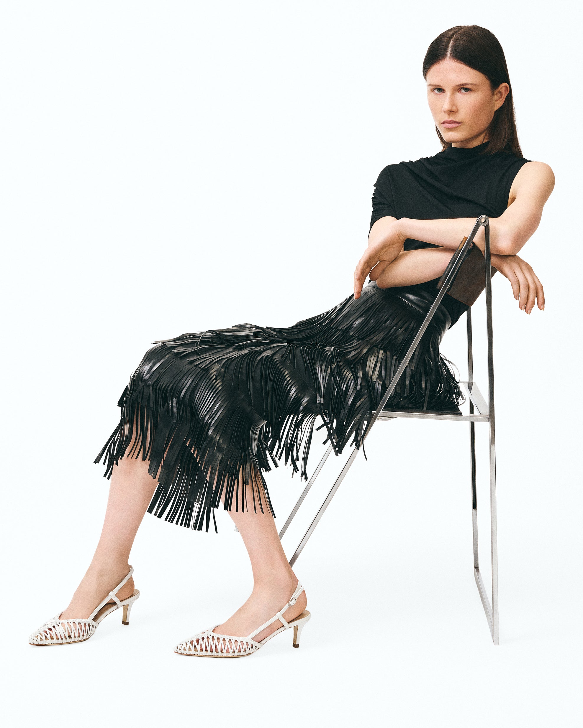 Renzo Black pointed-toe pump with ankle strap and small spool heel