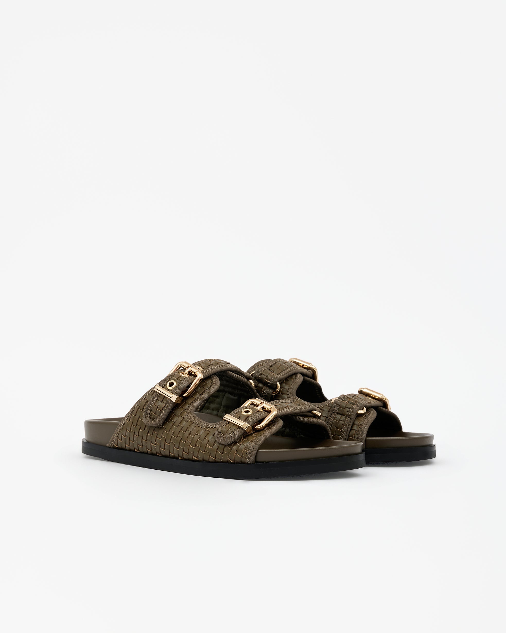 Eero Black flat mule with wide black leather strap