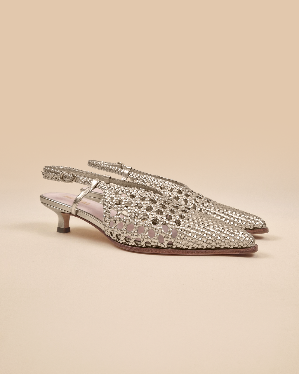 Marina Woven Gold woven faux leather slingback pump with a small spool heel