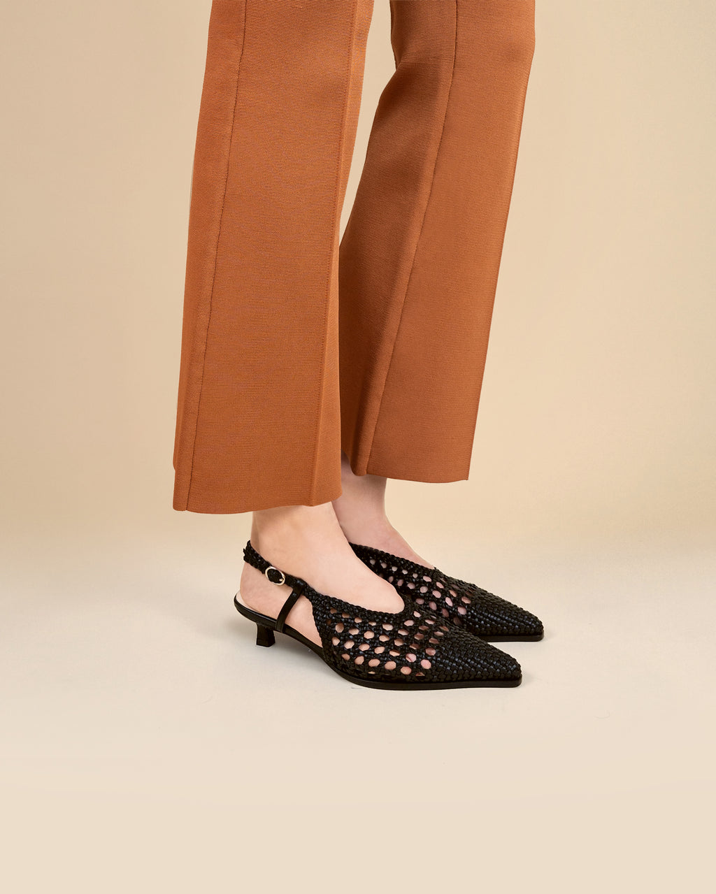 Marina Woven Black woven faux leather slingback pump with a small spool heel