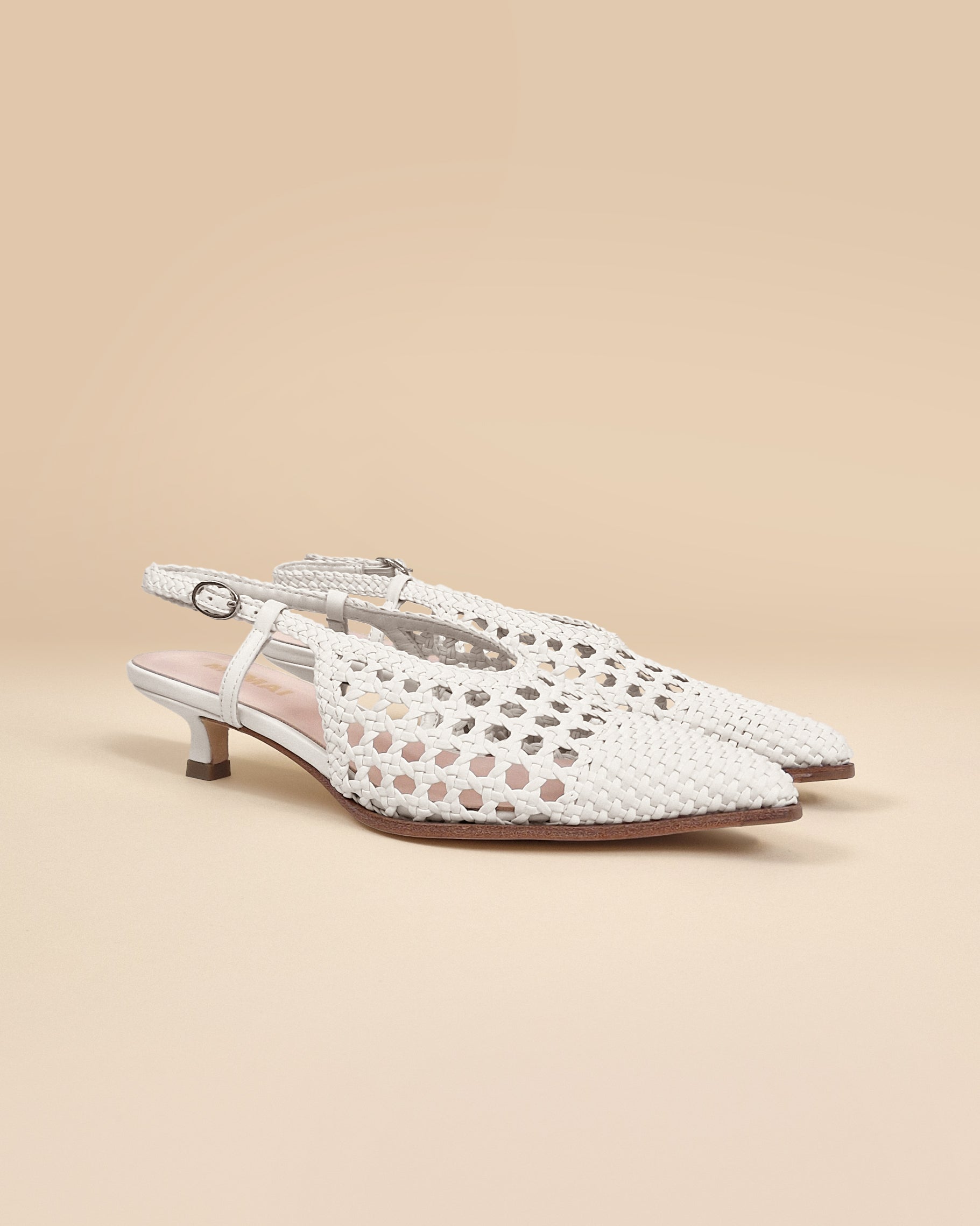 Marina Woven White woven faux leather slingback pump with a small spool heel