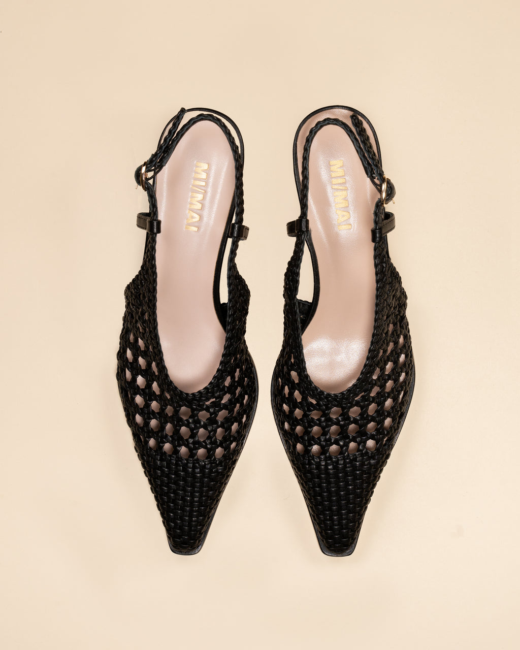 Marina Woven Black woven faux leather slingback pump with a small spool heel