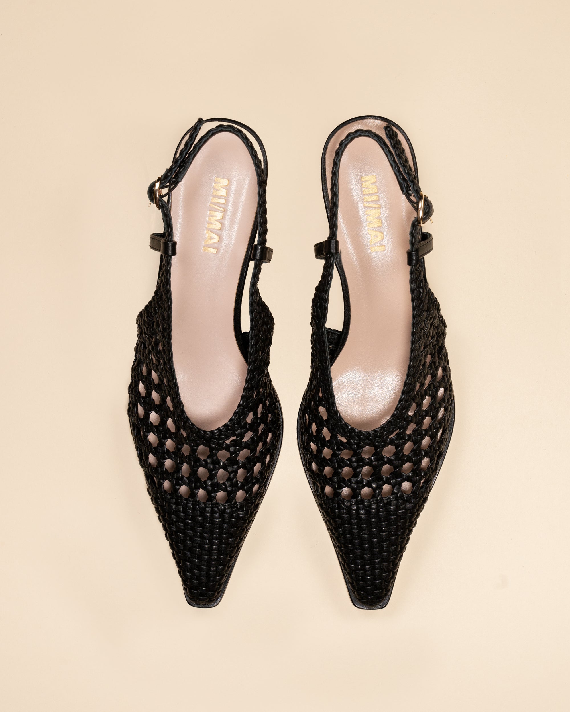 Marina Woven Black woven faux leather slingback pump with a small spool heel