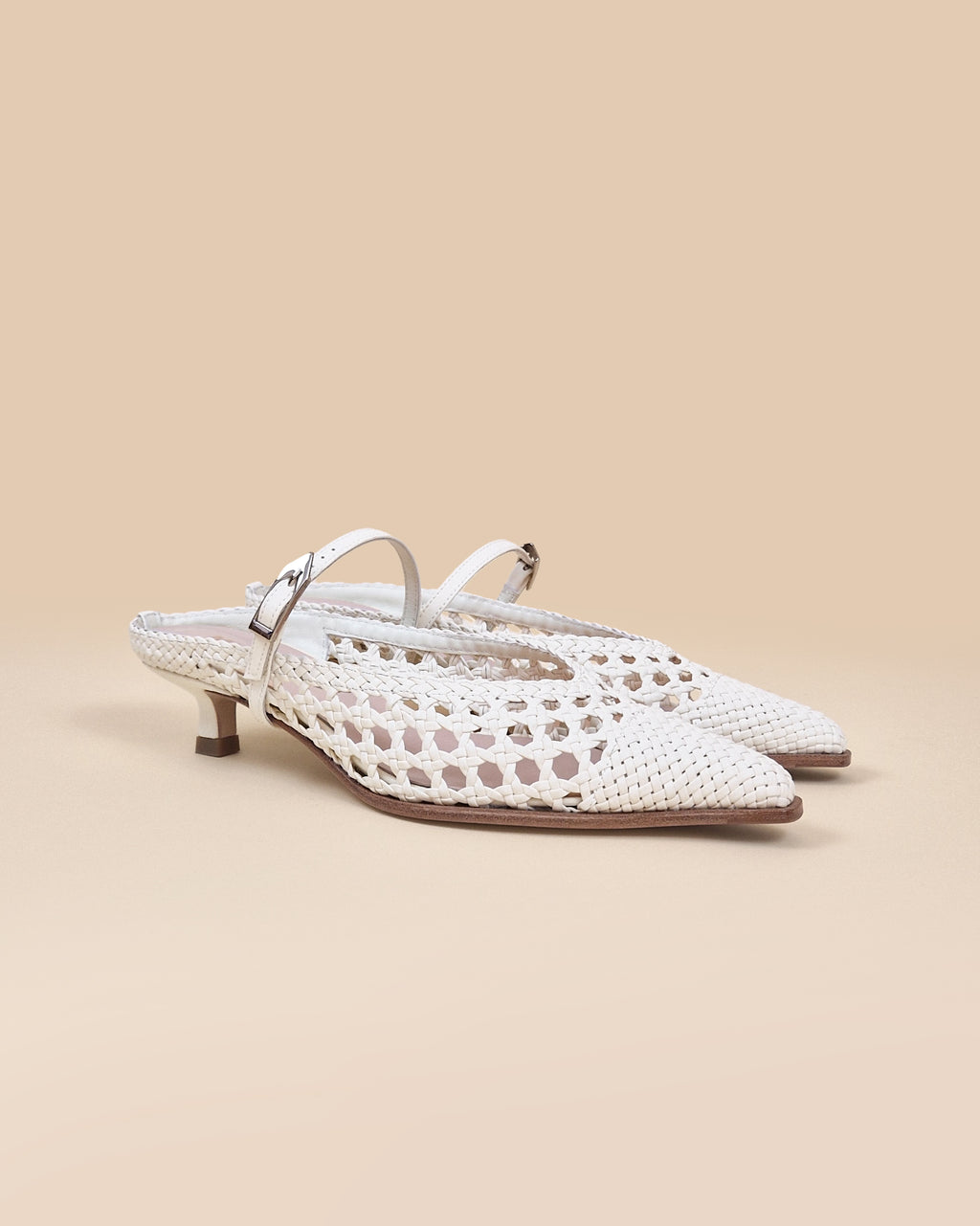 Pointed toe mule pump with small spool heel in white woven faux leather Suzanne Woven White